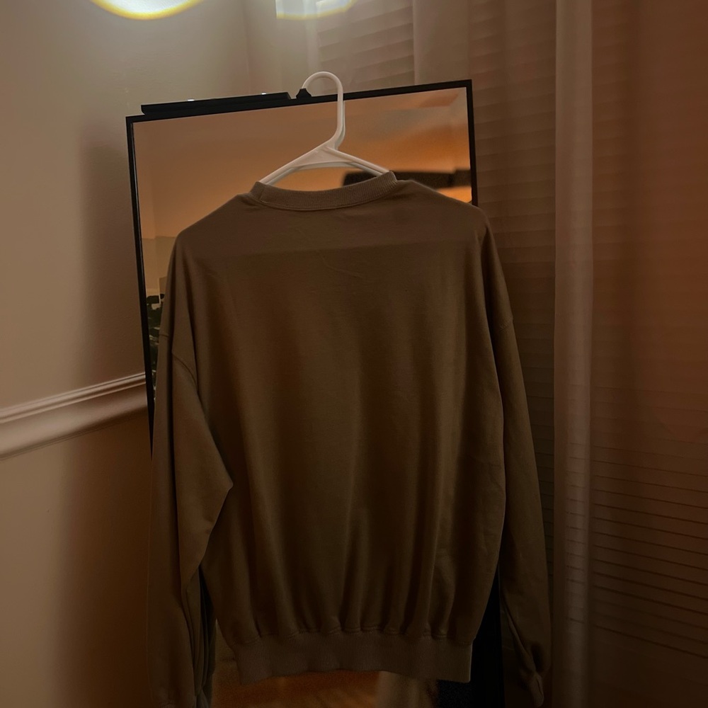 Army green sweater.